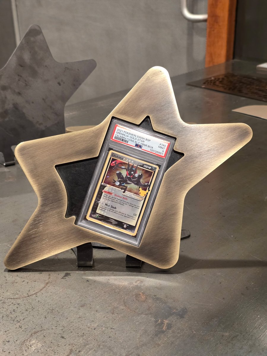 HypeSafety's tweet photo. The team fabricated a gold star #pokemon 1/4" brass PSA slab display stand today! The patina really came out great, as did the contrast on the black steel mount.

Can't wait to find more gold stars to occupy these! https://t.co/7dRTl7B3SR