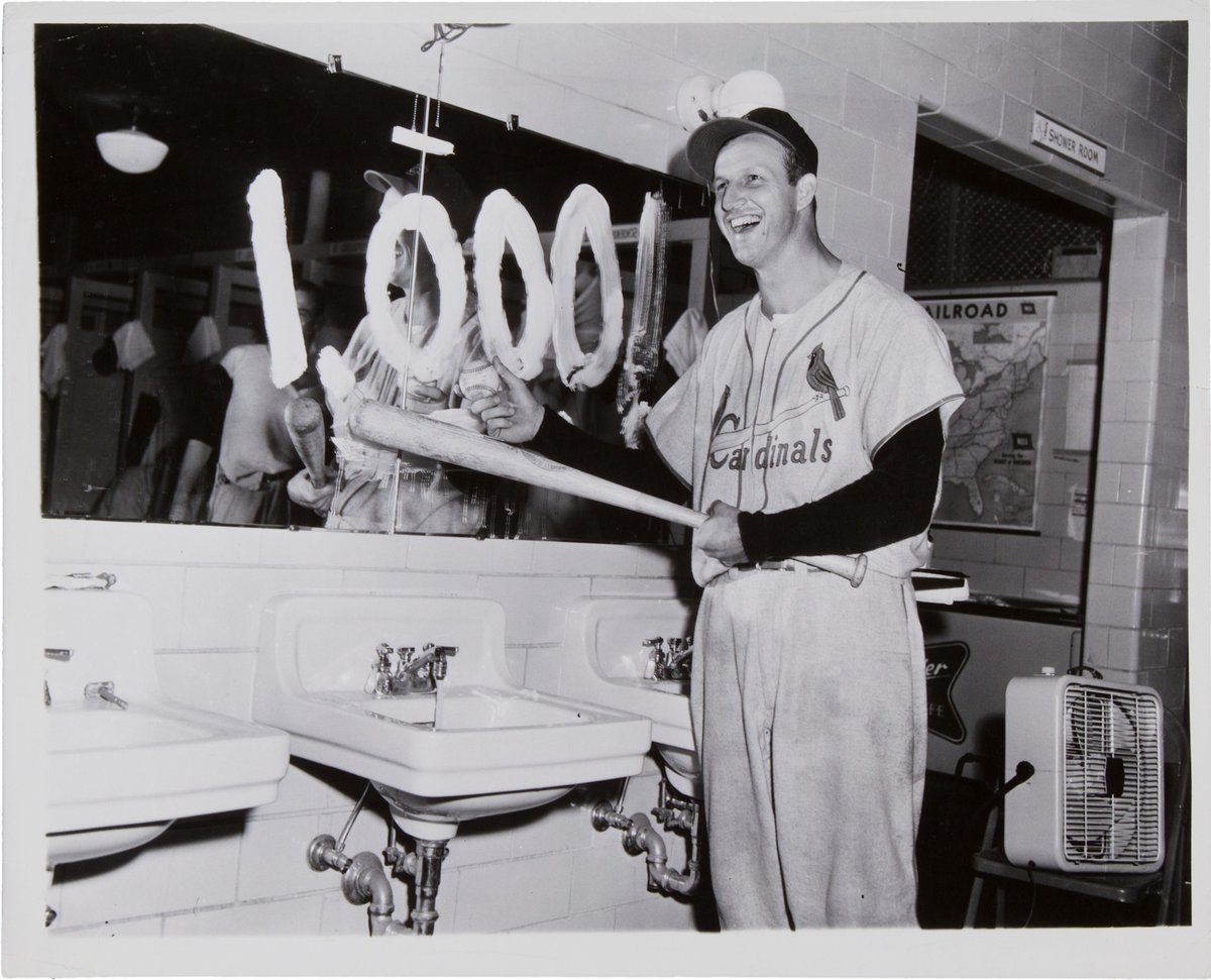 AugieNash's tweet image. #OTD 1948 - Stan Musial slashes his 1000th career hit - an RBI triple in Chicago against the Cubs.

What a great photo - Stan's smile, the shaving cream used on the mirror and the railroad poster in the background!

#STLCards
