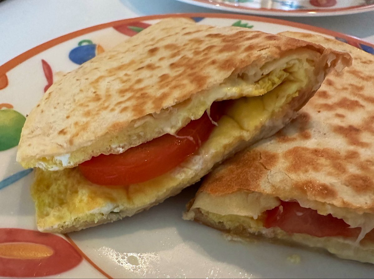 free_style_chef's tweet image. The breakfast taco / quesadilla theme this week continues with an egg, cheese, and tomato version today. The avocado was not ripe. 

#brekkie #tacos #omelet