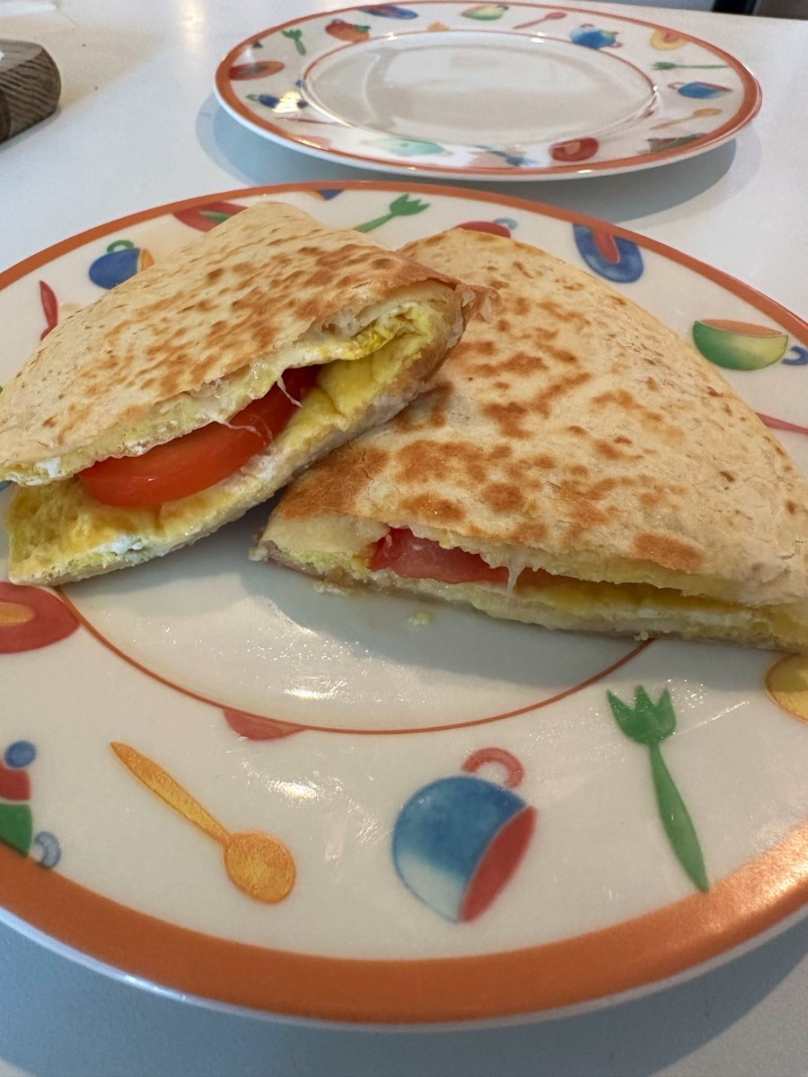 free_style_chef's tweet image. The breakfast taco / quesadilla theme this week continues with an egg, cheese, and tomato version today. The avocado was not ripe. 

#brekkie #tacos #omelet