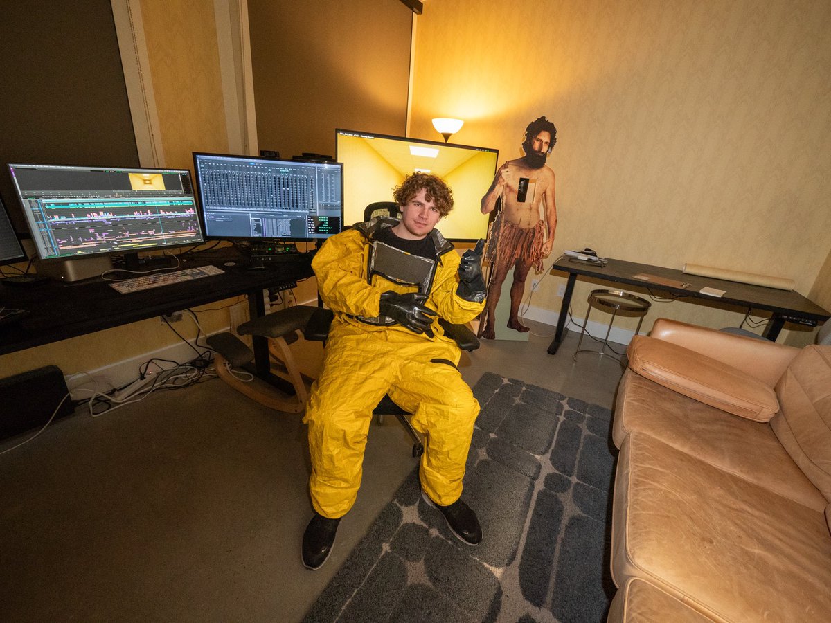 Kane Parsons sitting in the post-production office for Backrooms wearing his own ASYNC HAZMAT! 

In the background, you can also see a Caveman SIMILAR to the one from Found Footage #3!