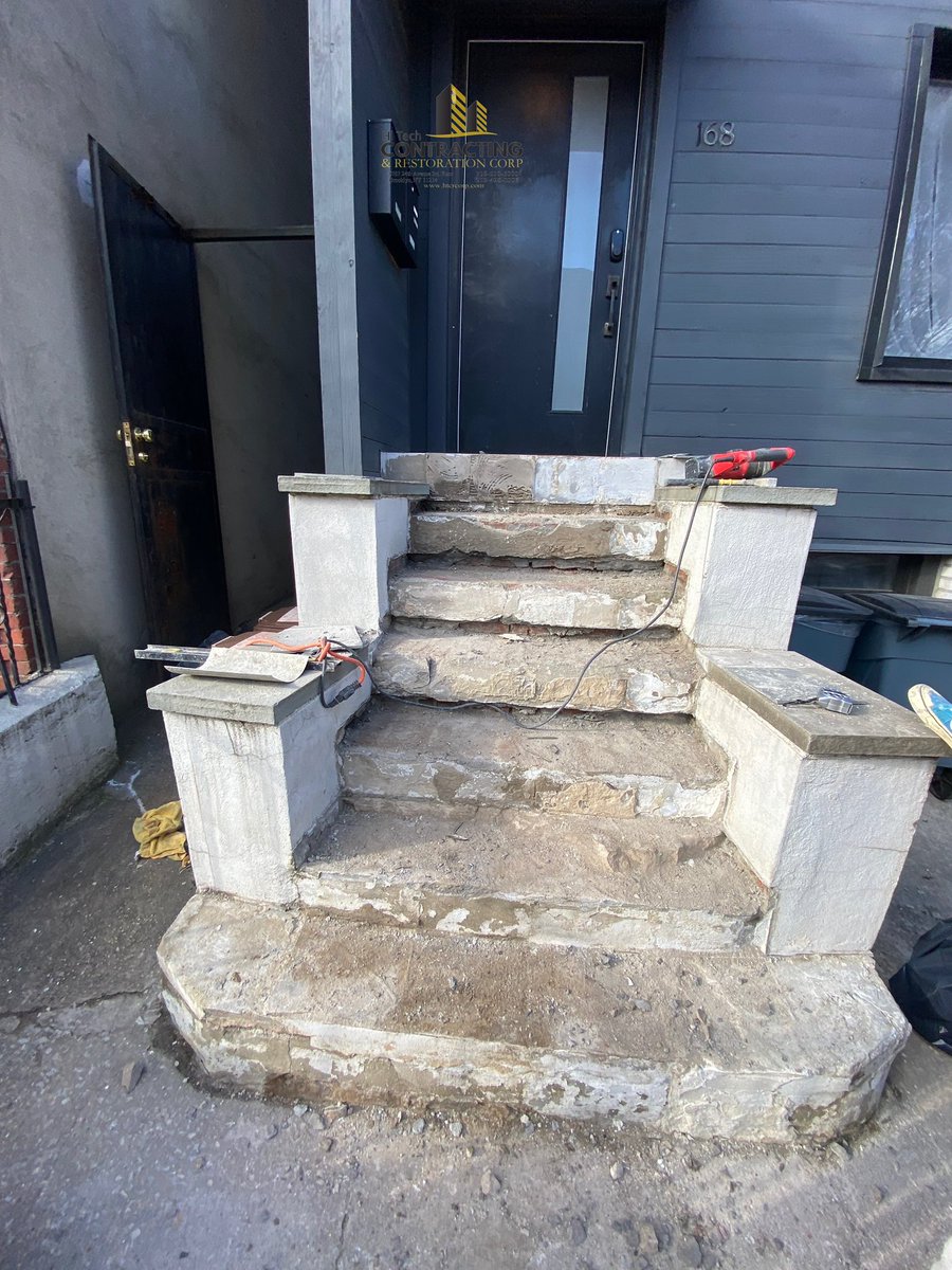 htcrcorp's tweet photo. Hi Tech Contracting & Restoration Corp.
Front Steps Resurfacing & Restoration – Bushwick, Brooklyn, NY

⸻

Project Overview
Complete restoration of existing front entry steps to eliminate trip hazards, reinforce structure, and deliver a clean, modern, and waterproof finish.

⸻

Demolition & Surface Preparation
Removal of all deteriorated limestone and existing tile assemblies from treads and risers.
Full cleaning and power washing of steps and sidewalls to ensure proper substrate adhesion.

⸻

Structural Reinforcement
Installation of galvanized wire mesh across risers and vertical surfaces to enhance bonding strength and prevent future cracking or delamination.

⸻

Masonry Restoration (Risers & Walls)
Application of new masonry cement stucco system over reinforced areas, forming a smooth, uniform, and durable base.

⸻

Bluestone Installation (Treads)
Precision installation of new bluestone treads on all step surfaces, providing a modern aesthetic with long-term durability and slip resistance.

⸻

Waterproofing System
Application of two coats of Thorocoat waterproofing on all risers and step walls, protecting against moisture penetration and extending the life of the system.

⸻

Final Result
A structurally reinforced, waterproofed, and visually refined front entry built for long-term performance.

⸻

📞 718-510-6000
🌐 https://t.co/h3bkAd4DRk
#htcrcorp #masonrystucco #hitechcontracting #waterproofingcompany #bushwickcontractors