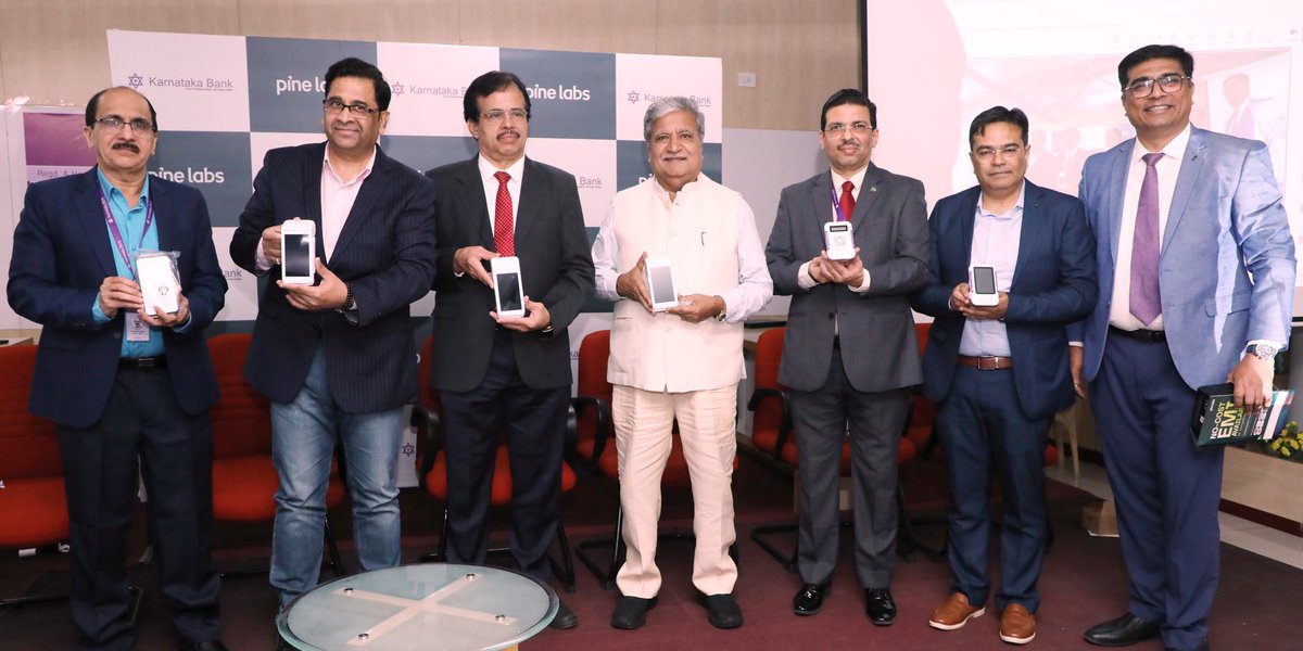 KarnatakaBank's tweet photo. Karnataka Bank has partnered with Pine Labs to introduce smart, secure, and seamless PoS solutions aimed at empowering merchant growth and enhancing customer convenience. Officials from Karnataka Bank and Pine Labs, along with a valued customer, are seen showcasing the PoS devices.
Seen in the picture are Mr. Raghavendra S. Bhat, MD & CEO, Karnataka Bank; Mr. Sumit Chopra, COO, Pine Labs; and valued customer Mr. Gopady Srinivas Rao, Chairman of the Mayura Group.
Also present on the occasion were Mr. Raja B. S, Chief Operating Officer, Karnataka Bank; General Managers of the Bank – Mr. Jayanagaraja Rao S, Mr. Nagaraja Upadhyaya B, Mr. Raghuram H. S, and Mr. Venkateswarlu Mallineni, Head of Liabilities Sales & Third-Party Products – along with other senior executives of the Bank.
Also present were officials from Pine Labs, including Mr. Swapan Ghosh, EVP – Bank Alliances, and Mr. Umesh Gorde, Head – Bank Distribution.