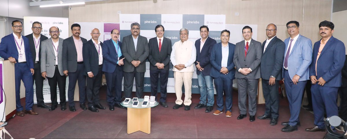 KarnatakaBank's tweet photo. Karnataka Bank has partnered with Pine Labs to introduce smart, secure, and seamless PoS solutions aimed at empowering merchant growth and enhancing customer convenience. Officials from Karnataka Bank and Pine Labs, along with a valued customer, are seen showcasing the PoS devices.
Seen in the picture are Mr. Raghavendra S. Bhat, MD & CEO, Karnataka Bank; Mr. Sumit Chopra, COO, Pine Labs; and valued customer Mr. Gopady Srinivas Rao, Chairman of the Mayura Group.
Also present on the occasion were Mr. Raja B. S, Chief Operating Officer, Karnataka Bank; General Managers of the Bank – Mr. Jayanagaraja Rao S, Mr. Nagaraja Upadhyaya B, Mr. Raghuram H. S, and Mr. Venkateswarlu Mallineni, Head of Liabilities Sales & Third-Party Products – along with other senior executives of the Bank.
Also present were officials from Pine Labs, including Mr. Swapan Ghosh, EVP – Bank Alliances, and Mr. Umesh Gorde, Head – Bank Distribution.