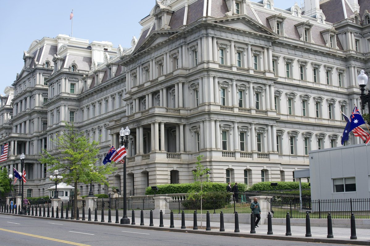The British and Australian flags line 17th Street for the arrival of King Charles.