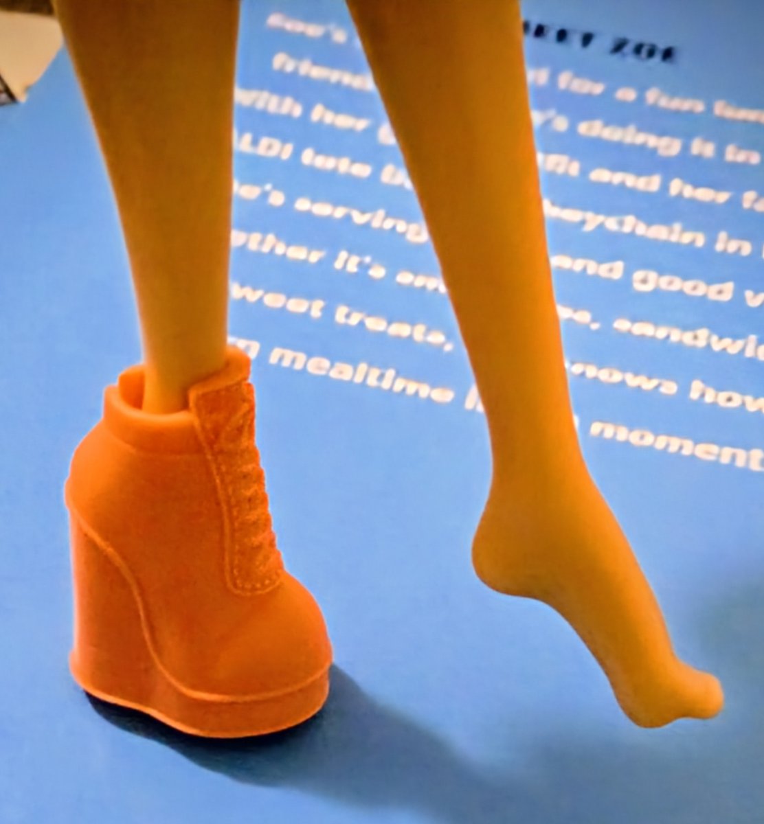 The shoes from the Kuu Kuu Harajuku dolls kinda fit the Aldi's doll.
At least its cuter than the clunky shoes she came with!