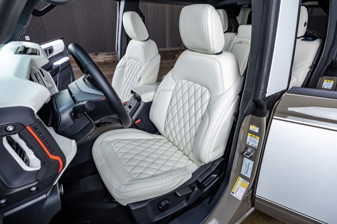 liftedtrucks's tweet image. Old school style, new school luxury. Our custom built #Retro Broncos are beautiful!! Like this 2026 4X4 at our #McKinney TX location with only 11 miles! Check out the interior on this one! Stock TX09205. Featuring custom Katskin leather interior, paint matched fender flares, hood