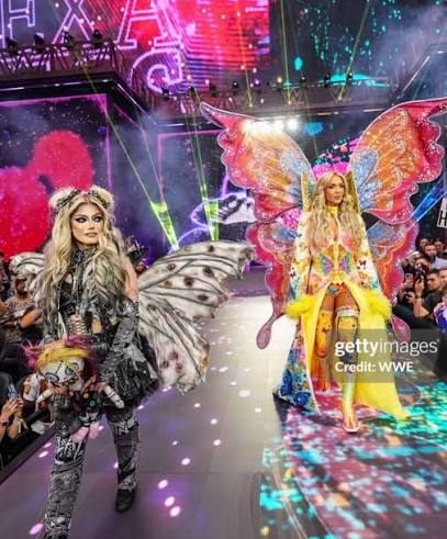Ringroyalty2099's tweet image. #FitFriday Tag Team Edition 🦋👑

​Light vs. Dark. The Queen vs. The Goddess. 🎰💎

​Charlotte Flair and @AlexaBliss_WWE gave us the most iconic visual of #WrestleMania42 with their coordinated butterfly/moth gear. 🦋🌑 It’s not just about the look—it’s about the work required to
