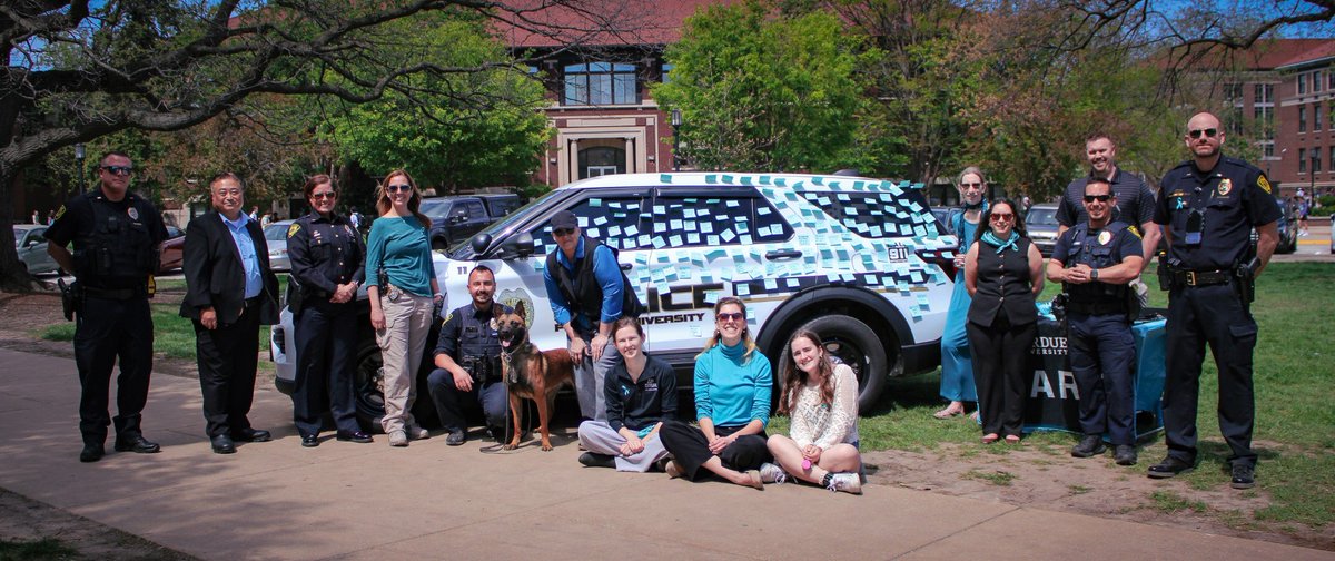 Purdue_Police's tweet photo. PUPD participated in the “Cover the Cruiser” event earlier this week. 🚓 This annual collaboration between PUPD and the Center for Advocacy, Response and Education (CARE) helps raise awareness and support for survivors of sexual assault. https://t.co/LrnblvBvxR
