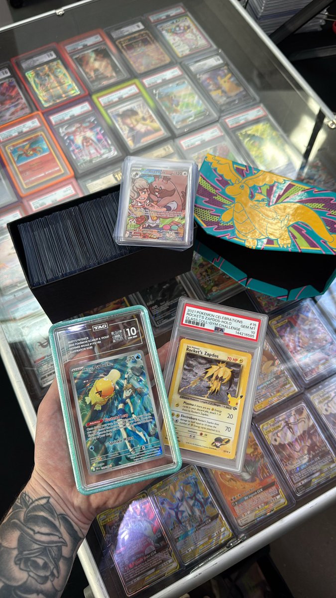 kingpindegen's tweet image. ASC ETB singles/ bulk of some ex’s/ ir’s, and first partner set in trade for TAG 10 Misty’s Psyduck + PSA 10 Rocket’s Zapdos. Bought another lucario poster, 2 ASC bb’s, and 2 mini tins.

How was the trade??

Time to rip.

#pokemon