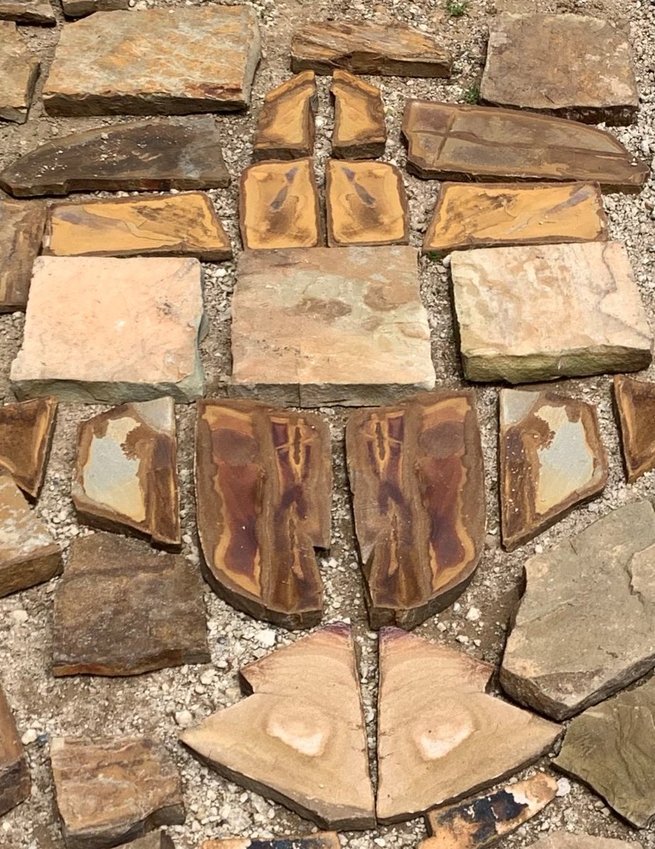 This is the roughed out shape of a Phoenix I created using bookend stone split with hammer and chisel, never knowing what each strike would reveal. The colors were so intense that it became the focal point of the walkway that led to my house a lifetime ago.
Can you see it?