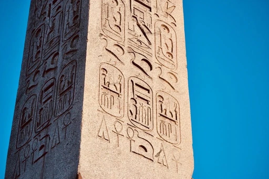 Megalithic12000's tweet photo. An obelisk has been standing in the centre of Paris for nearly 200 years.

Millions of people have walked past it. Egyptologists have studied it since the 1820s.

In 2021 a professor noticed something on his daily walk that nobody had seen in over three millennia.

Jean-Guillaume Olette-Pelletier of the Sorbonne noticed the hieroglyphs seemed to gesture toward something. He returned with binoculars, then notebooks.

When scaffolding appeared ahead of the Paris Olympics he climbed it, becoming the first person to study the upper inscriptions up close since it arrived in France in 1836.

🔹Seven messages encoded across all four faces
🔹Meaning shifts depending on viewing angle
🔹Some only visible from boats on the Nile
🔹Undetected for nearly two centuries in Paris
🔹A rare encoding technique few can read

The technique is called crypto-hieroglyphics.

One inscription spells out the pharaoh's full throne name from one angle and proclaims his eternal life from another.

Messages designed to be read by nobles arriving by boat, invisible to everyone else standing in the same spot.

Ramesses II was notorious for appropriating older monuments and inscribing his name on them. How much of what we read on these structures reflects who built them and how much reflects who claimed them later is a question that has never been fully closed.

If seven encoded messages were hiding in plain sight on one of the most studied monuments on earth for two centuries, what else are we missing?