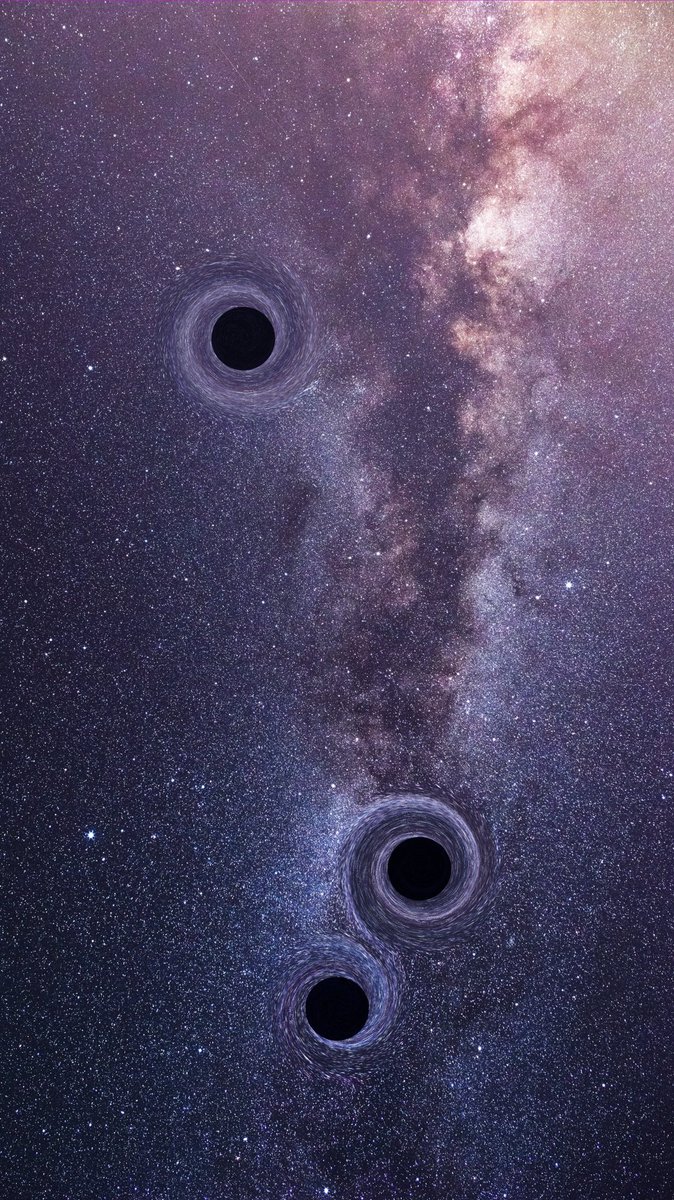 🚨: An extremely rare event, 3 supermassive black holes have been caught colliding and shaking space-time.
