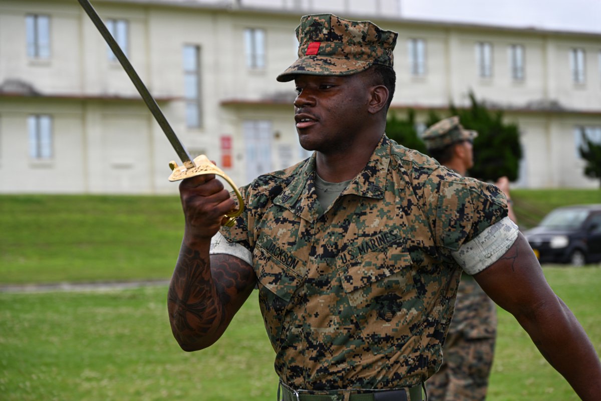 Marines with 3rd Marine Logistics Group rehearse sword manual and guidon drill movements during Corporals Course 4-26, Camp Foster, Okinawa, Japan, April 10, 2026.