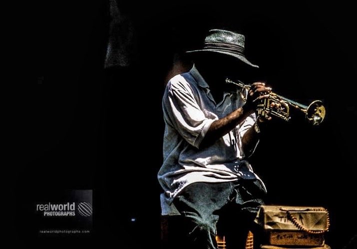 RealWorldImage's tweet image. A busker belts out a tune from a trumpet in New Orleans, Louisiana, USA. Gary Moore photo. Real World Photographs. #Louisiana #NewOrleans  #USA #photojournalism #world #Grok #Nikon #streetphotography #blackandwhitephotography #garymoorephotography  #realworldphotographs