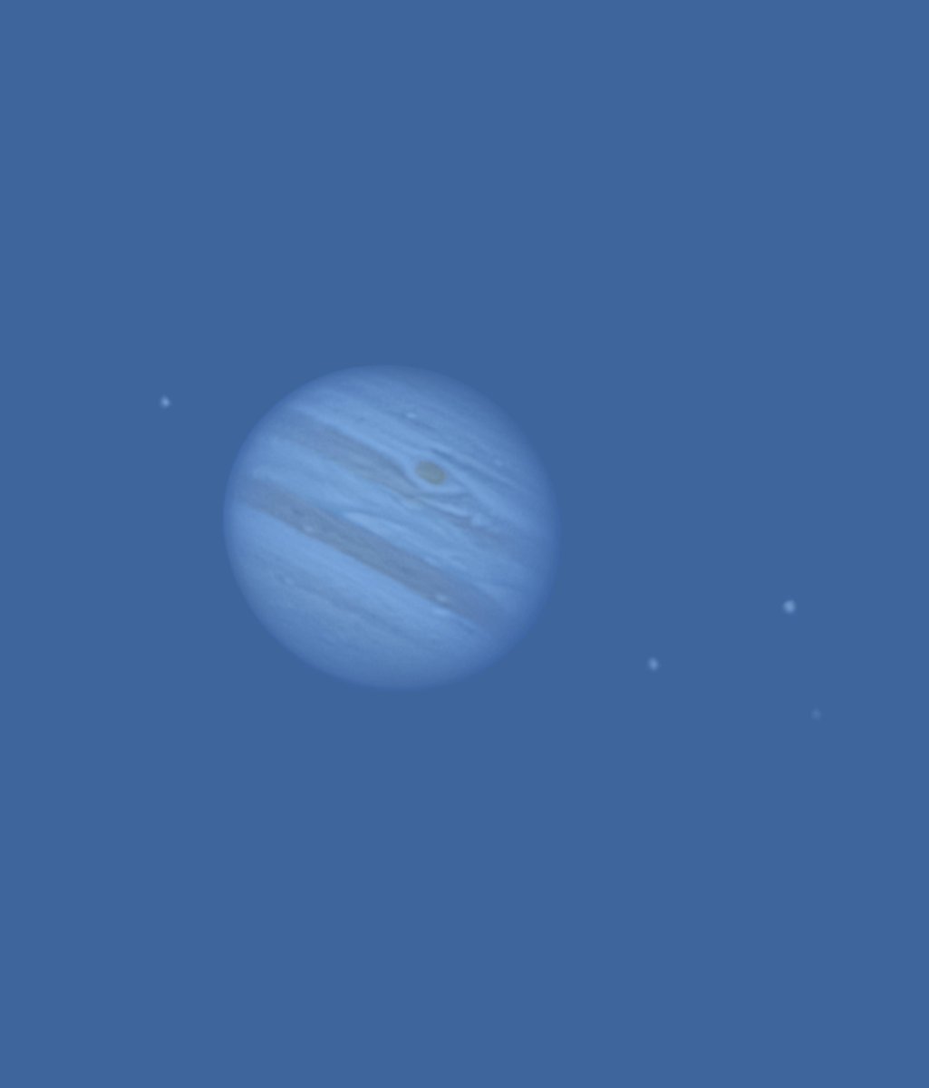 Jupiter and its moons in broad daylight through a telescope
