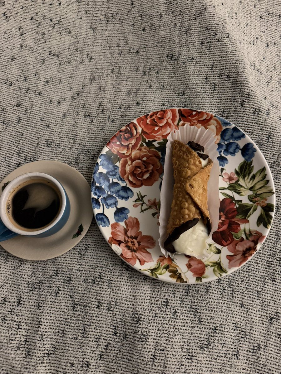 Cannoli with a cup of coffee