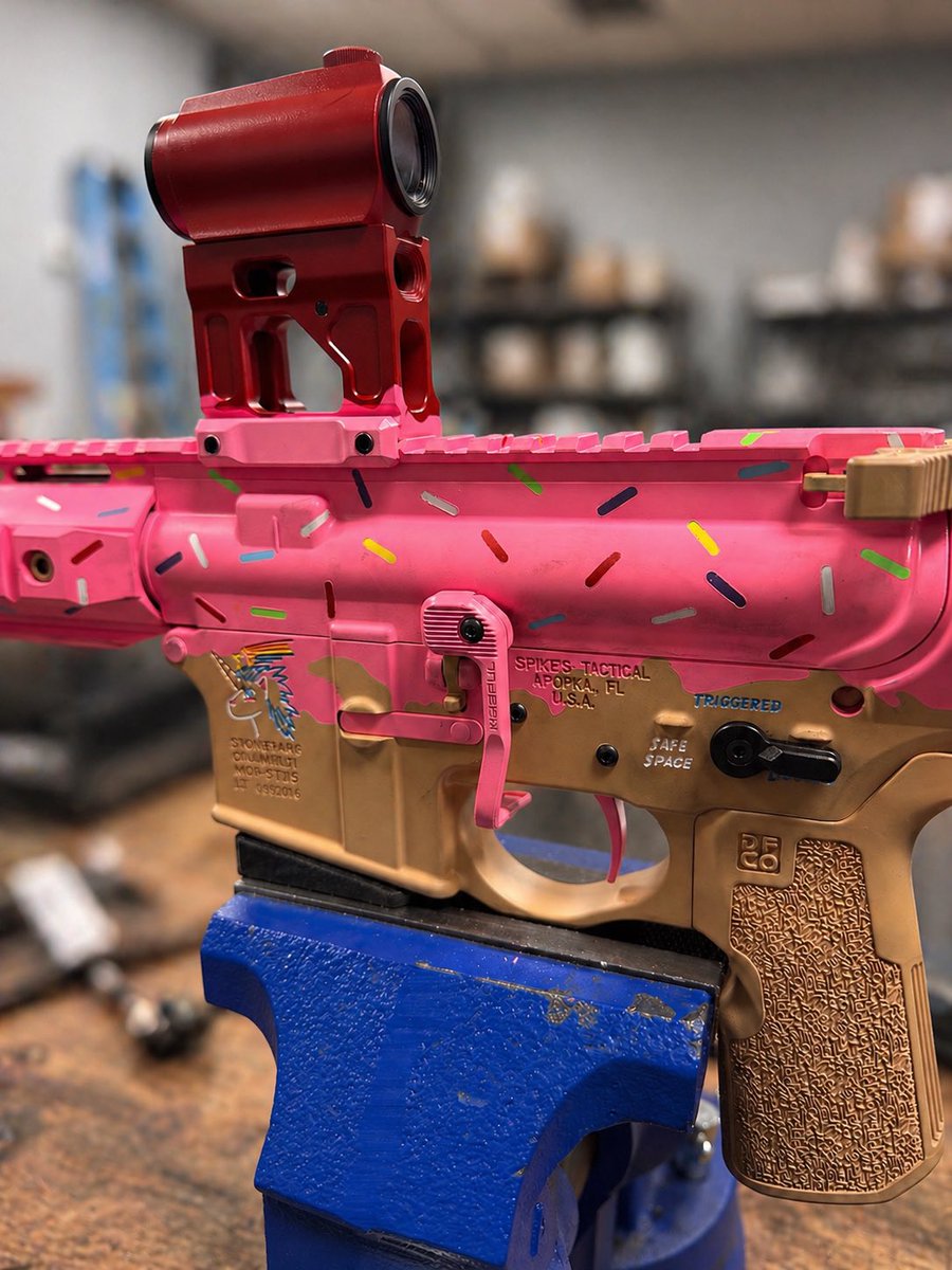 PenguinArmyHQ's tweet photo. We don’t just sell guns. We build art. 🍩 🔫 
Custom Cerakote by Tactical Penguin on this @spikes_tactical Snowflake lower — the “Sprinkles” build. Pink upper, hand-applied confetti sprinkles, FDE lower, and a jelly donut red optic and mount to tie it all together.
Yes, the selector says “SAFE SPACE.” You’re welcome. 😂
Bring us your vision. We’ll make it real.
🐧 https://t.co/frg5Ze1PsX
📍 Utah’s Premier Firearms Destination
#TacticalPenguin #CerakoteByTP #CustomCerakote #Sprinkles #SpikesTactical #Snowflake #AR15 #Utah #2A #Cerakote #GunArt #BuildOfTheDay