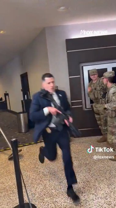 MicxeyMouse's tweet image. Guy that supposedly shot the shooter runs away "after" shooting him (for the cameras). So staged. 
#shooting