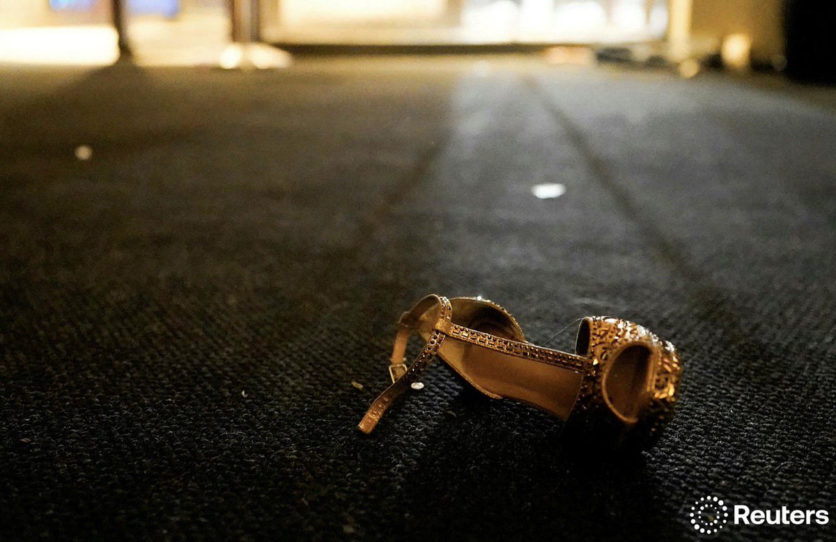 Rtoayji's tweet photo. A shoe lies on the floor as people evacuate the annual White House Correspondents’ Association dinner after a reported shooting incident in Washington, D.C., U.S., April 25, 2026. REUTERS/Elizabeth Frantz
#Trump https://t.co/JjIq5CmVtS