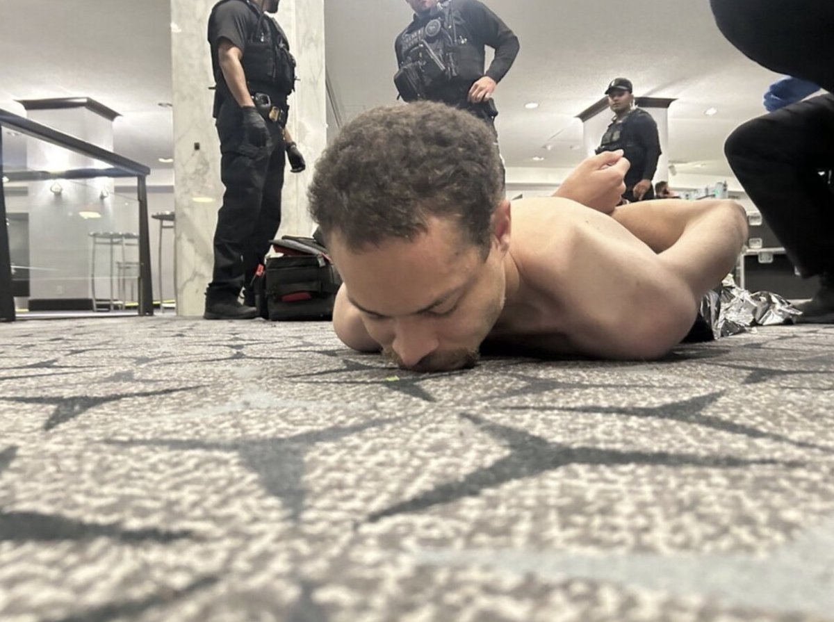 upuknews1's tweet image. #NOW : Photos posted by Donald Trump shows the suspect, identified in reports as Cole Thomas Allen, on the ground surrounded by law enforcement officers at the Washington Hilton following the White House Correspondents' Dinner shooting.

#DonaldTrump #WhiteHouse #WHCD