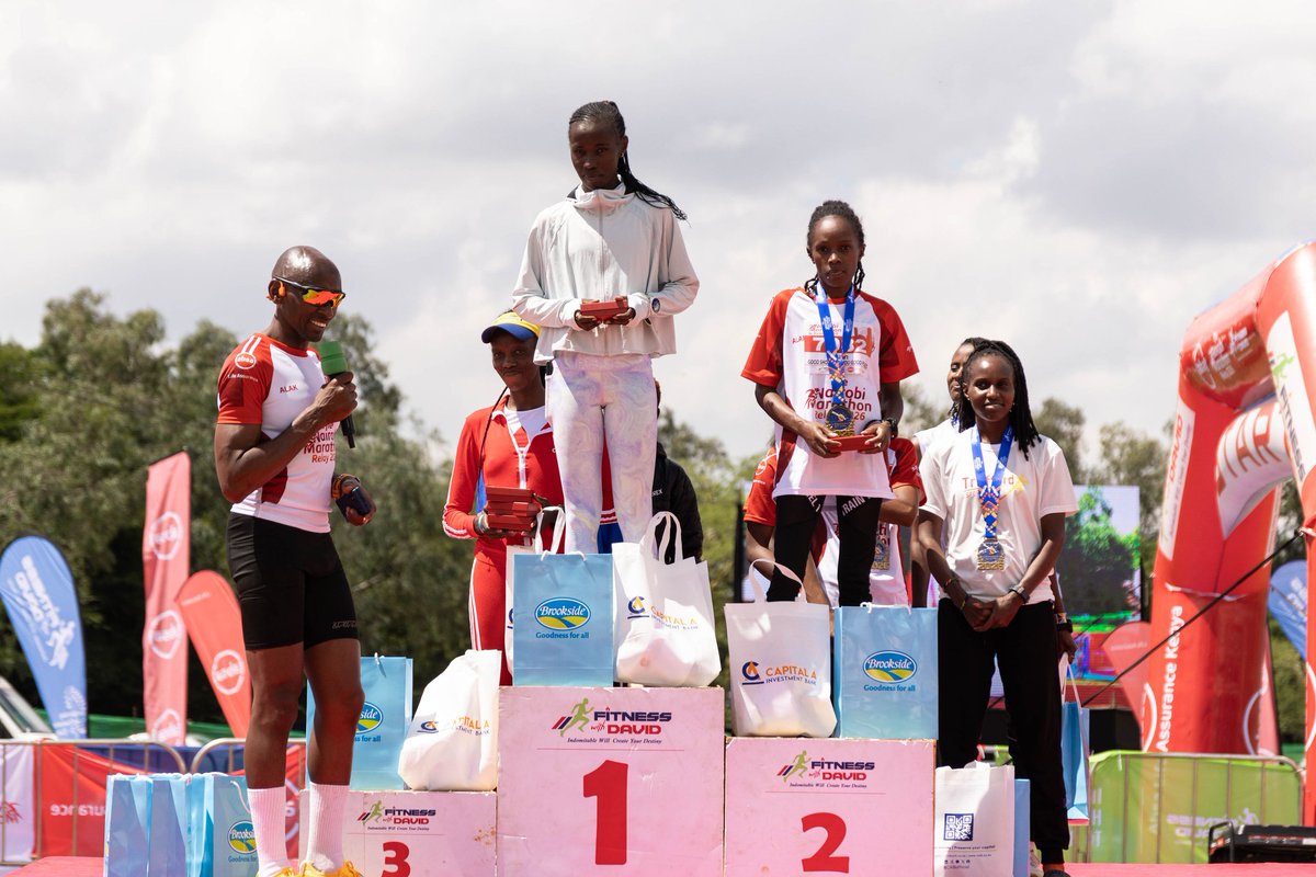 AbsaLifeKenya's tweet photo. Baton down, results up. The #NairobiMarathonRelay2026 wraps with Team 1.59.30 Attempt and Podium Crasher Ladies taking top honours in their categories. Our MD,Githanji Waiguru, awarded Esther Kioko, Captain of Podium Crasher Ladies, with pride in winning the moment. https://t.co/l5t2qVm0ND