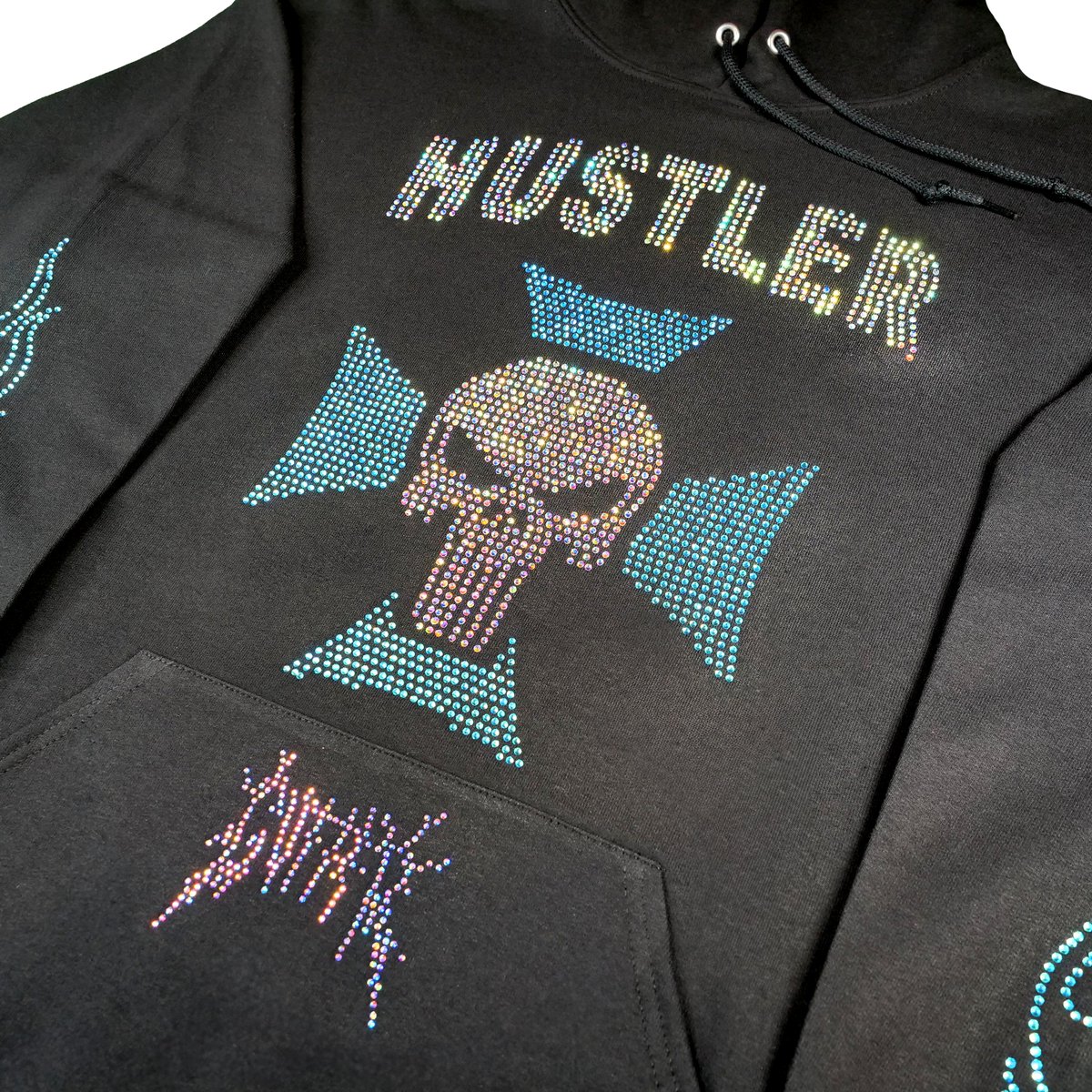 guttercompound's tweet photo. The Rhinestone Hustler Hoodie is coming soon - who’s ready for this one? Let ‘em know.🩸⭐

- Rhinestone Hustler Design On Center Chest
- Rhinestone Crystal Blue Flames On Both Sleeves
- Splat Logo Print On Center Hoodie Pocket
- Heavyweight, 100% Cotton Black Pullover Hoodie https://t.co/7w2TYcCEGU