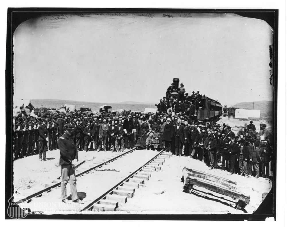UPRRMuseum's tweet photo. On this day 157 years ago, May 10, 1869, the last rail of the First Transcontinental Railroad was laid, completing its construction and connecting the nation. This image, taken by Andrew Russell, shows the crowd gathered to watch the ceremony. https://t.co/w25zzIDALX