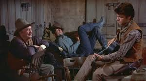 Fcsnva's tweet photo. Happy birthday wishes to #RickyNelson (BOTD 1940) wherever he may be. Some say he is the weak link in RIO BRAVO, but they are dead wrong, he holds his own with a cast of pros, and when they sing "My rifle, My Pony, and Me," it is pure magic. That's how he should be remembered. https://t.co/rZAEBBG0Ax