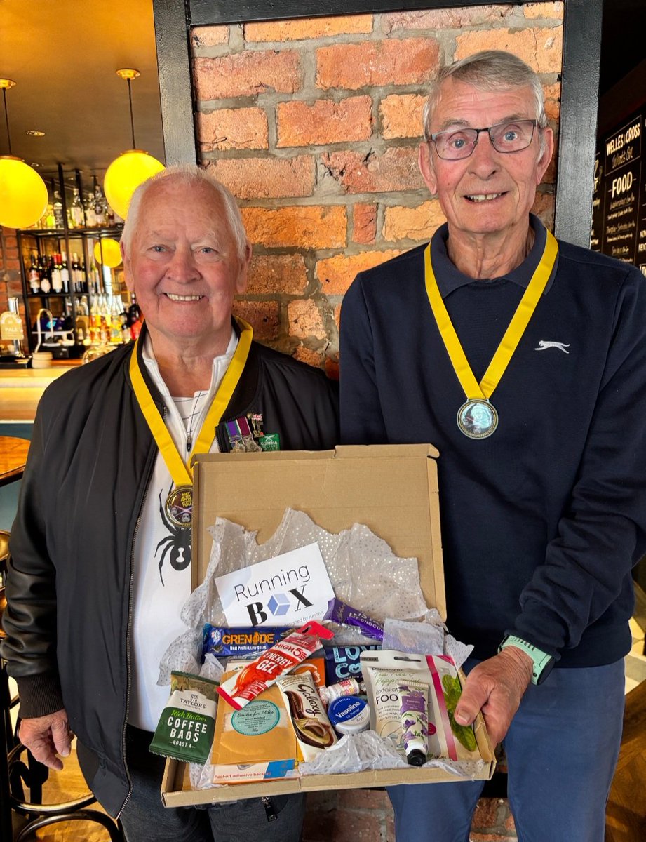 The_RunningBug's tweet photo. John and Neil entered our May the 4th virtual race. John was automatically added into a prize draw and won. John and Neil are showing off the medals and the raffle prize. They decided to share the prize.  
John is 76 and Neil is 77 which is proof that age is just a number. https://t.co/jFv9zL2ws1