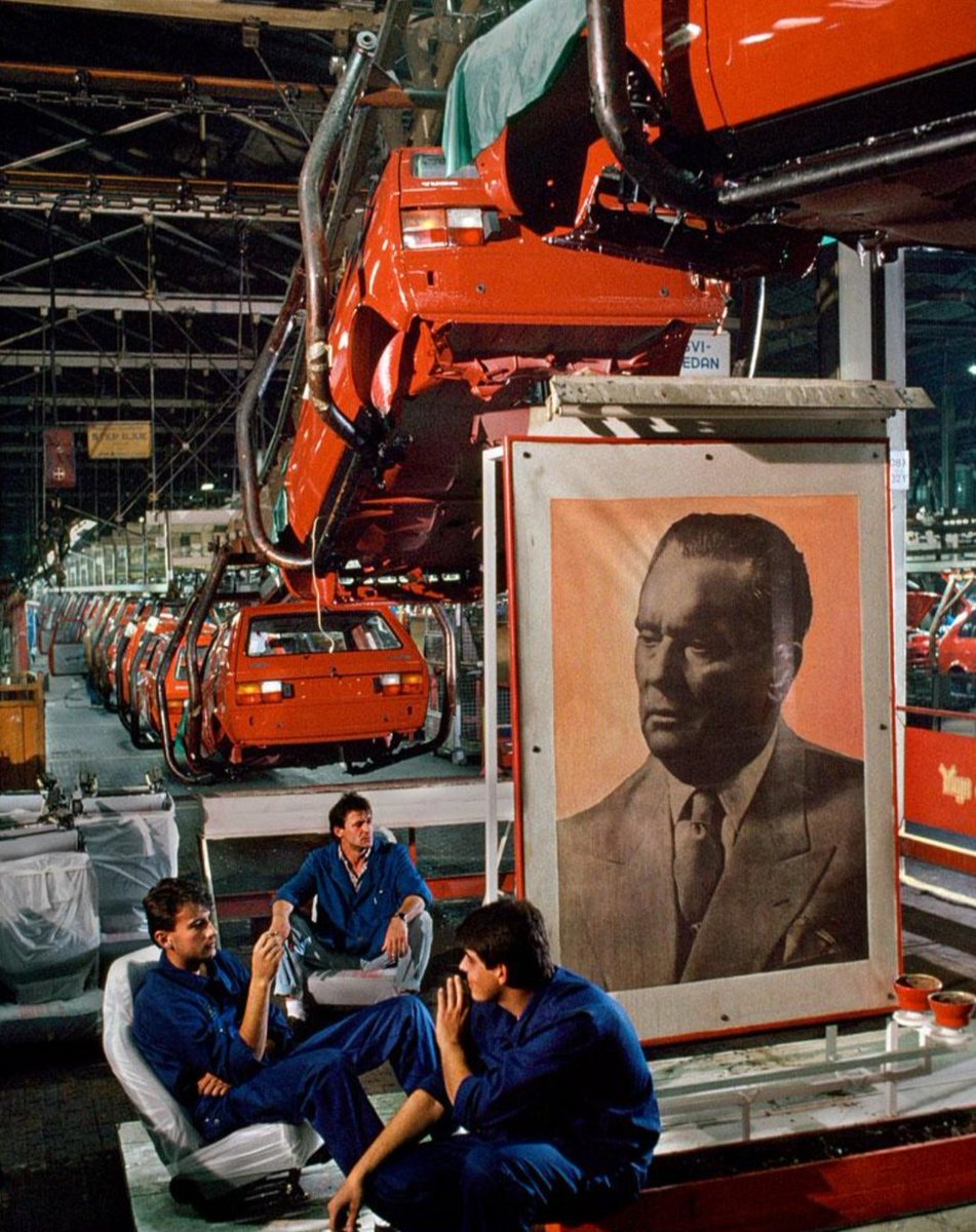 Tito keeps an eye on workers on a break at the Yugo car assembly plant in Kragujevac, 1980s.