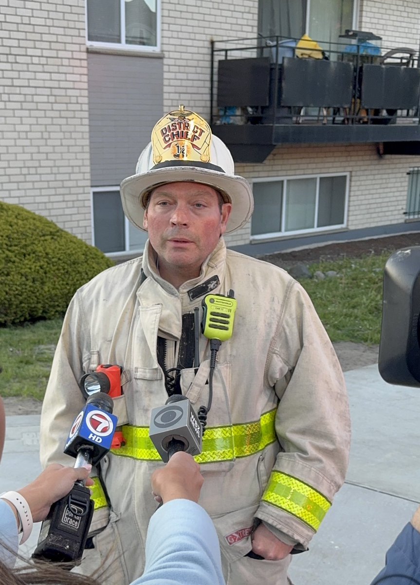 BostonFire's tweet photo. District Chief Vinitsky addressed the media. There are 5 adults &amp; 10 children displaced from the fire on Cummins Hwy. One EMS personnel was transported. BFD-VAU and the RedCross are on scene to assist with displaced. Est. damage is upward of $300,000. https://t.co/IvBdS98lah