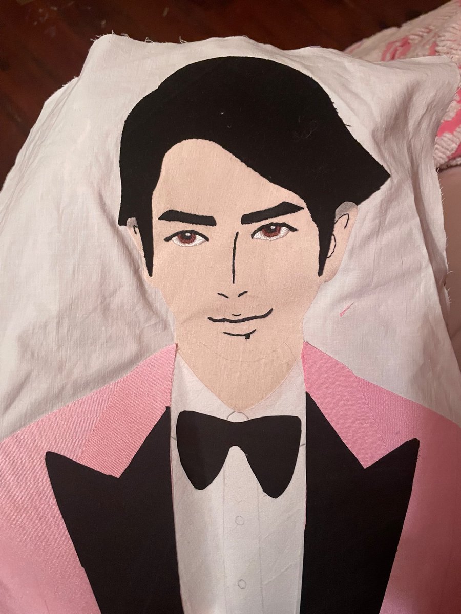 Ok so he's obviously not done and has a wrinkle that's distorting the face a bit but overall I'm so pleased with how ThrowPillowJun™️ is turning out!! I think his eyes came out so well 😭💜 (the face is hand embroidered and the rest is appliqué)