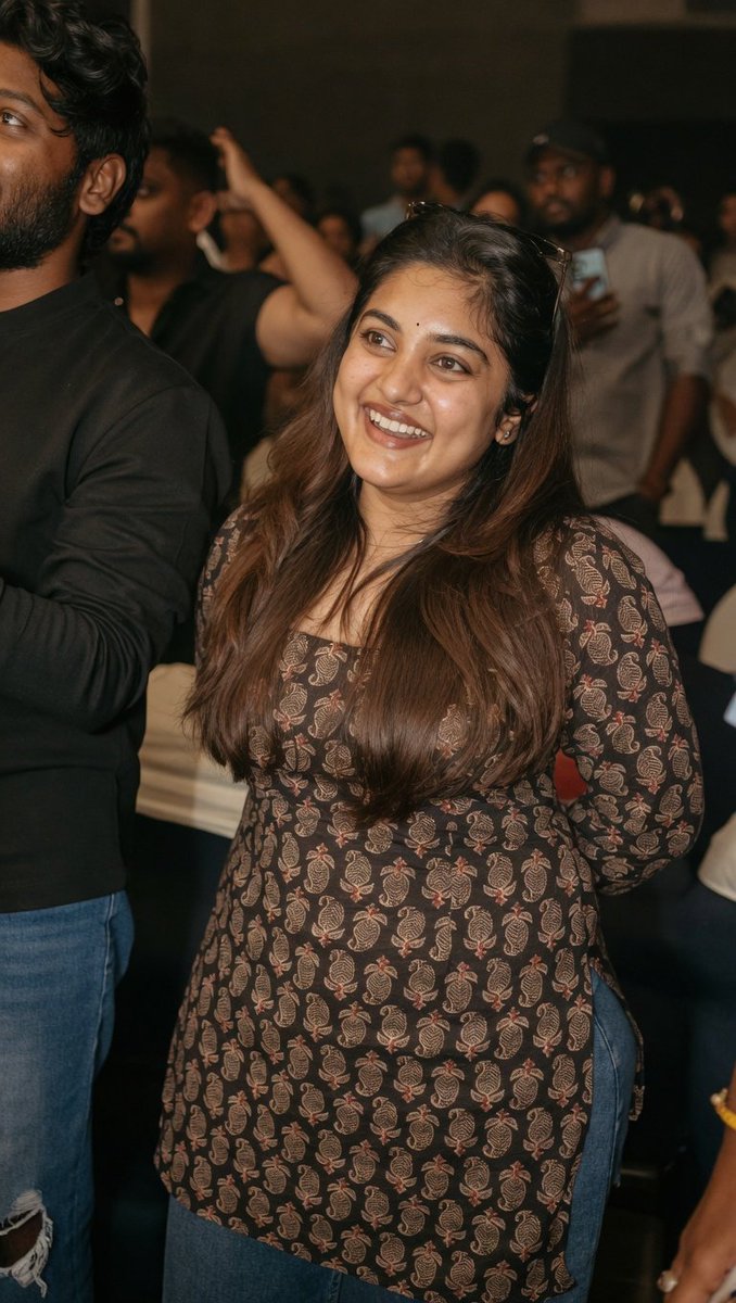 RoshUnfiltered's tweet photo. Nivetha Thomas enjoying the show of NinnuKori re release. 🔥 #NivethaThomas https://t.co/x6mppl8v4q
