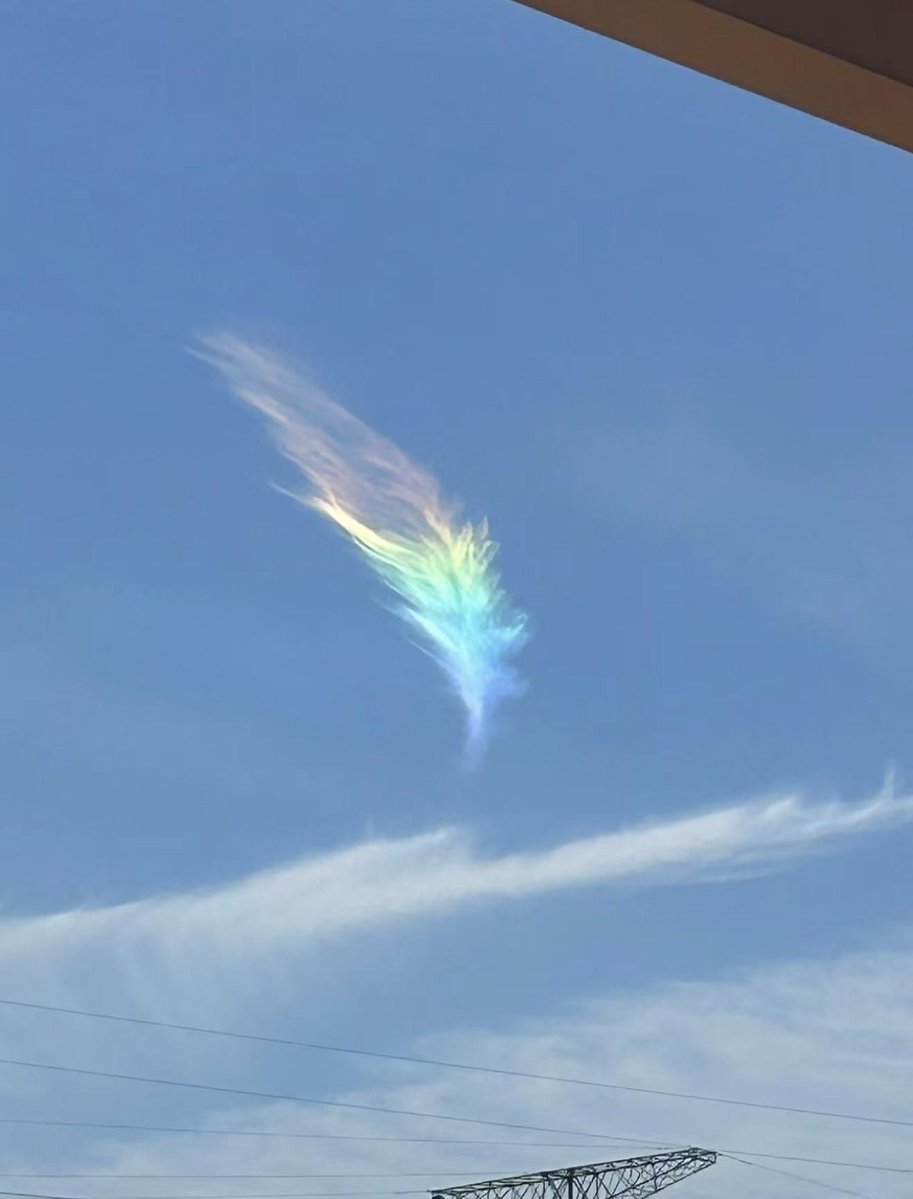 A “rainbow feather” in the sky over Jiangyin, China.

The colorful formation is known as an iridescent cloud, a rare phenomenon caused when sunlight passes through tiny ice crystals or water droplets in high-altitude clouds.