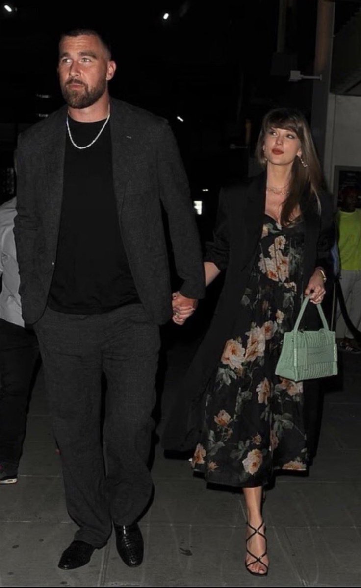 lol, this is what Taylor looks like next to Travis.