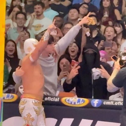 BTS wearing wrestling masks and taking picutes with the wrestlers. They just be doing anything 😭😭