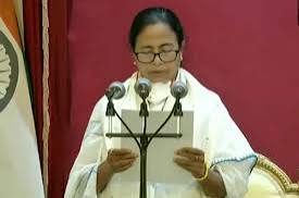 Breaking News : Mamata Banerjee takes oath at her residence, claims she is now the CM as she took oath before Suvendu Adhikari.
