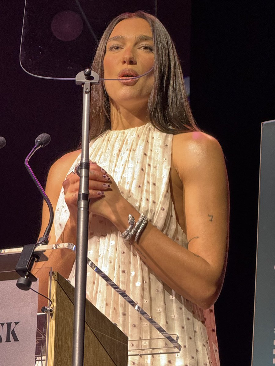 Burtini's tweet photo. I was fighting for my life with the auto-prompter but Dua Lipa last night at the International Booker Prize 10th Anniversary - I was not prepared for how beautiful she is in person! https://t.co/lg1Xvzscxe