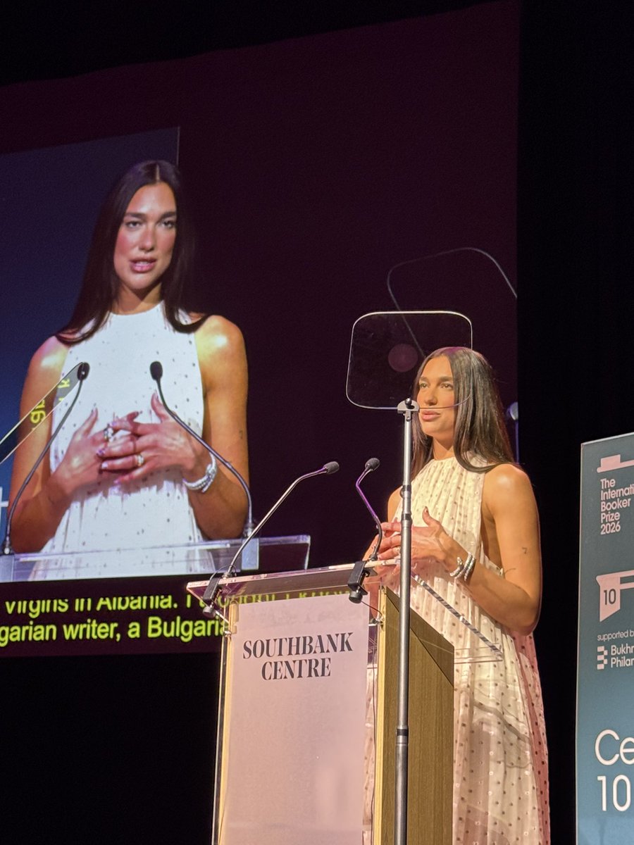 Burtini's tweet photo. I was fighting for my life with the auto-prompter but Dua Lipa last night at the International Booker Prize 10th Anniversary - I was not prepared for how beautiful she is in person! https://t.co/lg1Xvzscxe