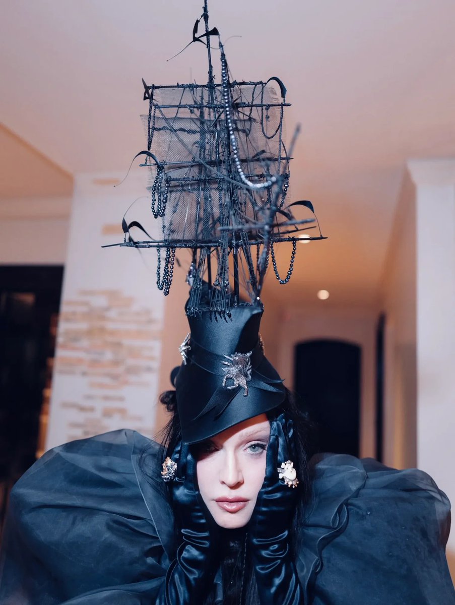 DrownedMadonna's tweet photo. Rita Melssen, Madonna’s stylist, sat down with Perfect magazine to give the full story behind the 2026 Met Gala look — here are the highlights we found most interesting. Full interview linked below.

On the concept: “The entire process felt kind of divine and fell into place naturally. She asked me to focus on surrealism and we landed on Leonora Carrington. We came across The Temptation of Saint Anthony and I said, ‘Imagine recreating this painting on the Met carpet.’ We instantly became attached to the woman with the ship on her head, blowing the horn and surrounded by angels. It also felt meant to be that the painting was titled The Temptation of Saint Anthony while she was attending with Anthony Vaccarello.”

On Isabella Blow’s ship hat: “The hat honestly chose us. I reached out to Philip Treacy asking if it would be possible to custom make a ship hat for the Met, even though we were less than a week away. He explained there wasn’t enough time, but mentioned they had Isabella Blow’s original ship hat — the one that Philip placed on her casket at her funeral — in the archive and was willing to bring it for Madonna to try. The moment she put it on, the entire room felt the power and presence of it. As Philip said, ‘Isabella is going to the Met on Madonna’s head.’”

On collaborating with Madonna: “We are extremely collaborative, she’s open to new ideas and transformation while always staying true to herself. She’s endlessly curious, fearless, and never interested in repeating herself. She is unbelievably detail oriented and never settles for less, so every collaboration becomes this deep creative education for me.”

https://t.co/QWt5PegRe1