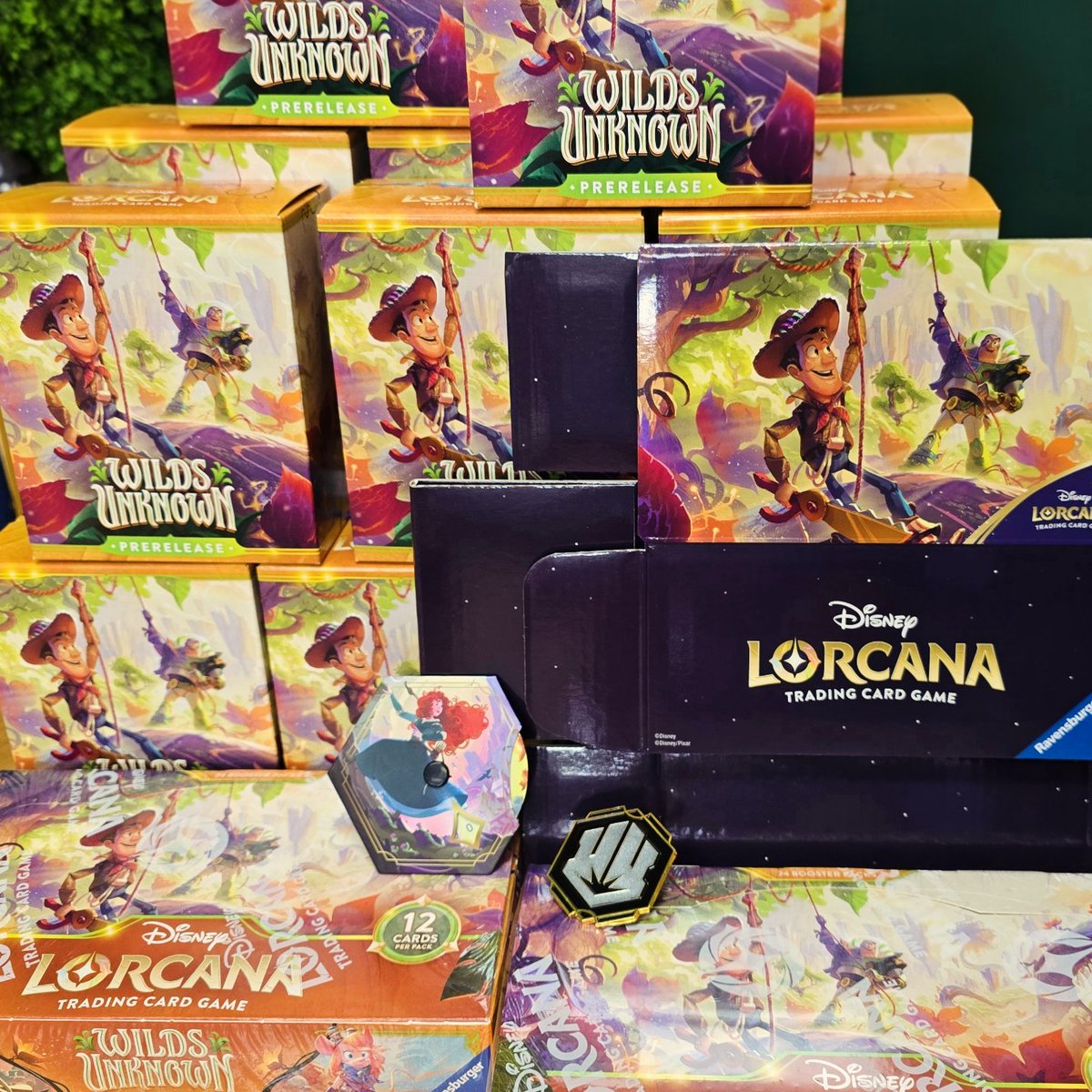 Illuminotts's tweet photo. Illuminotts have had so much fun @TheDiceCup today, playing in the Set 12 Wilds Unknown prerelease event for @DisneyLorcana 🧡 The prerelease boxes are a wonderful new addition, they are so good!
We also took a look at the Set 12 enamel pin, Brave Lore teacker, and storage box 🤩 https://t.co/7ISZ2P7S6O