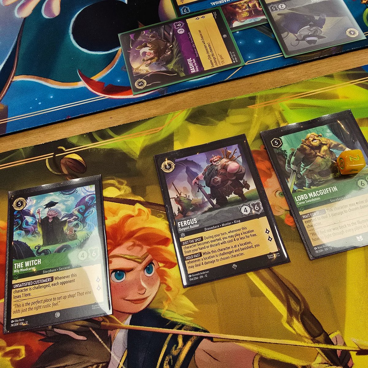 Illuminotts's tweet photo. Illuminotts have had so much fun @TheDiceCup today, playing in the Set 12 Wilds Unknown prerelease event for @DisneyLorcana 🧡 The prerelease boxes are a wonderful new addition, they are so good!
We also took a look at the Set 12 enamel pin, Brave Lore teacker, and storage box 🤩 https://t.co/7ISZ2P7S6O
