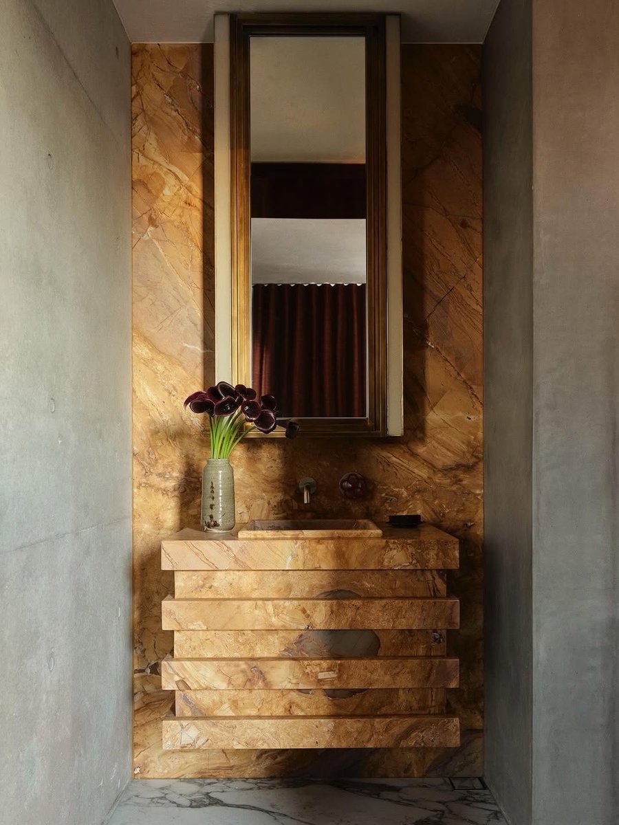 flackstudio_'s tweet photo. Within Redfern's concrete cocoon, the powder room offers unexpected tenderness. The back wall and sculpted basin emerge as one unbroken field of honey-toned Tavoire stone, reflecting how the home strikes a perfect balance between industrial rigour an... https://t.co/vMaiiYs0SM