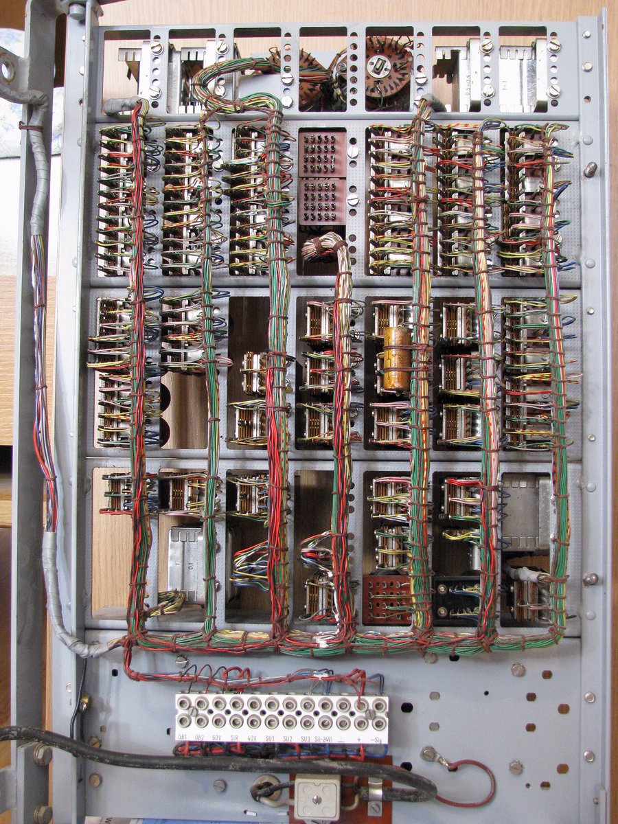 Displaying the art of wire cable lacing in this PABX (private automatic branch exchange) with relays and cable laced wiring harnesses (early 1970s technology).