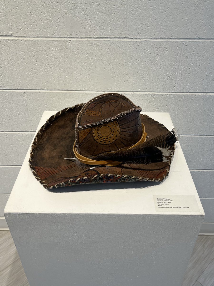 spARTanscreate's tweet photo. Justus Phelps at Mayor Mattie Parker’s reception, showcasing his striking Quanah Parker sculptural hat. It’s a powerful blend of history, artistry, and Texas spirit. @CHSSpartans @BurlesonISD @BISD_FineArts @TXarted https://t.co/52yorOjRyM