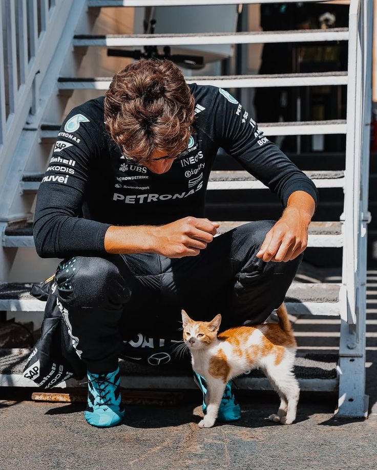 fakecke's tweet photo. these cat photos with George are genuinely my favourite photos of him https://t.co/Dg1WMyRe7r