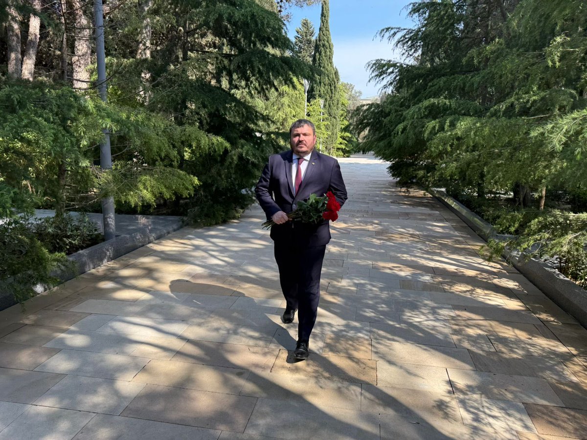 Husyev's tweet photo. Marking the 103rd anniversary of the birth of the National Leader of the Azerbaijani people, Heydar Aliyev, I paid tribute to his memory and laid flowers at the resting place of the distinguished statesman and his wife, Zarifa Aliyeva, at the Alley of Honor. https://t.co/Joubl9xYtm