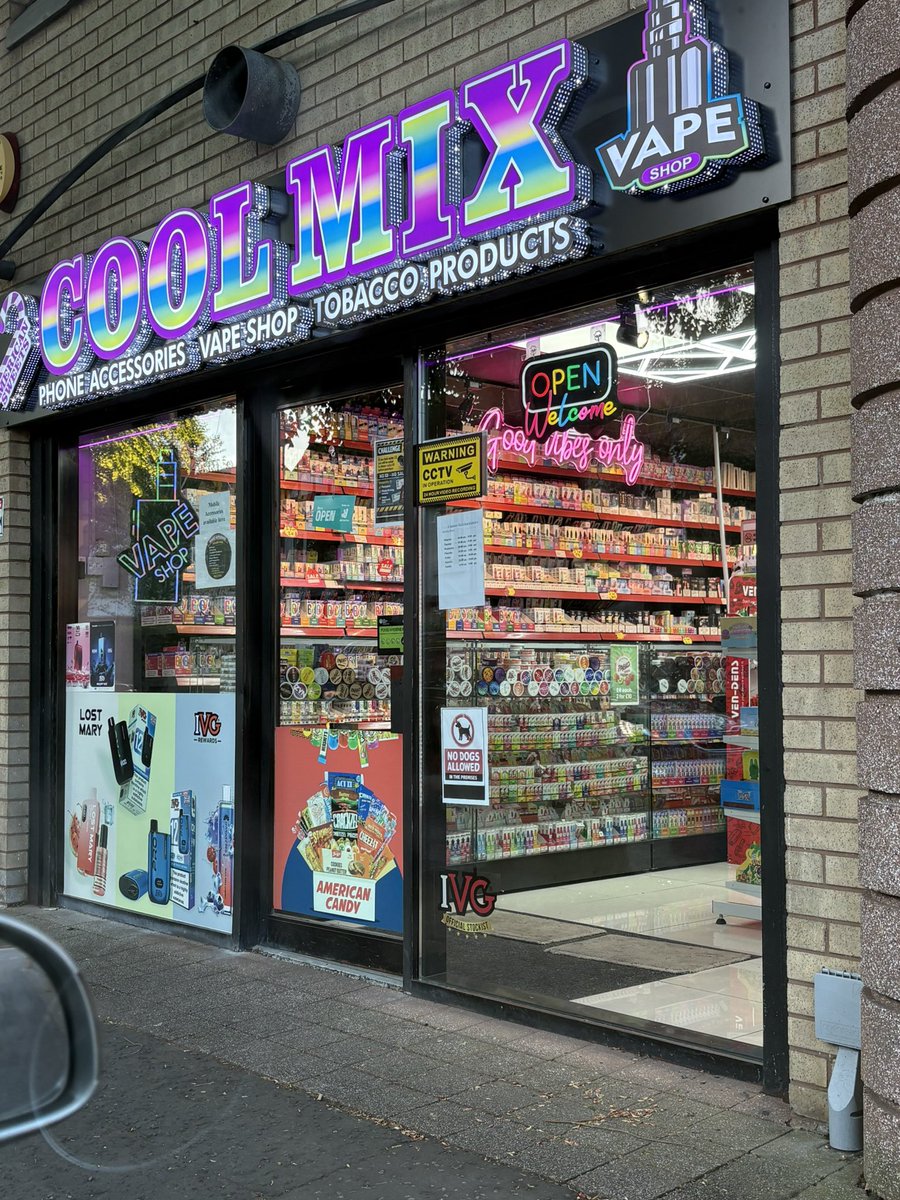 This is a shop in East Belfast. It sells vaping paraphernalia. Is this  designed to appeal to adults? Or kids, to get them excited about going in.  This is cynical exploitation of