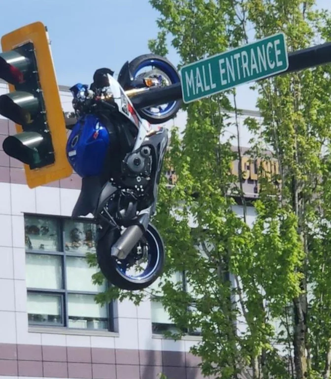 A motorcycle was left hanging from a traffic light in Delta, British ...